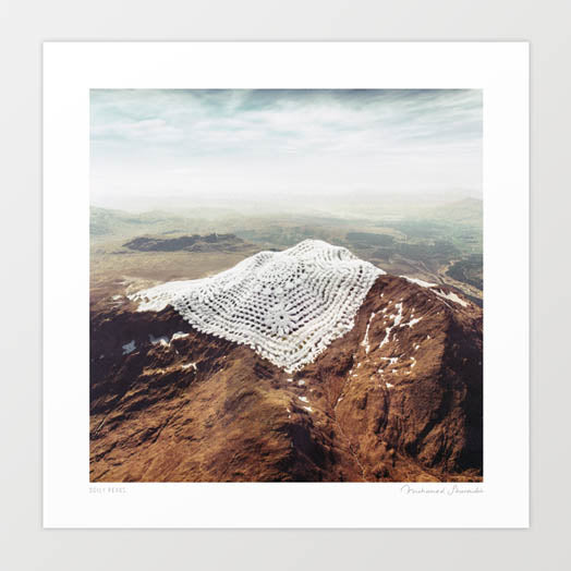 Doily Peak surreal art print — aerial view of a rugged terracotta desert mountain peak with a large white hand-crocheted lace doily draped over the summit where the glacier snow cap should be, the radiating crochet pattern mirroring topographic contour lines, climate change glacier loss art for craft lovers crochet enthusiasts textile artists and environmental art collectors